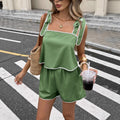 Women's tie-up tube top and elastic waist shorts set by Plush Fashion Hub, shown in three colors, featuring a stylish two-piece design.