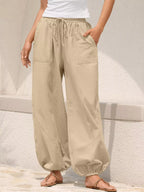 Casual loose-fit drawstring waist harem joggers by Trendsi, featuring relaxed fit and comfortable style, shown in the image.