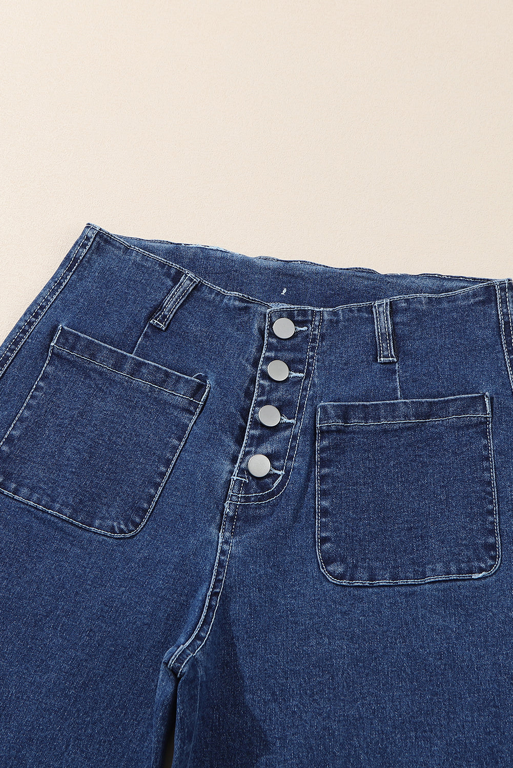 Light blue McKinley wide leg cropped jeans from Threaded Pear displayed on a hanger, showcasing relaxed fit and cropped length.