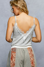 Women's ribbed V-neck cami top with eyelash lace trim, trendy sleeveless top from Trendsi, shown in black fabric with lace detailing.