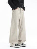 Men's wide leg casual comfort pants with relaxed fit and stretch fabric, shown in a neutral color on a model.