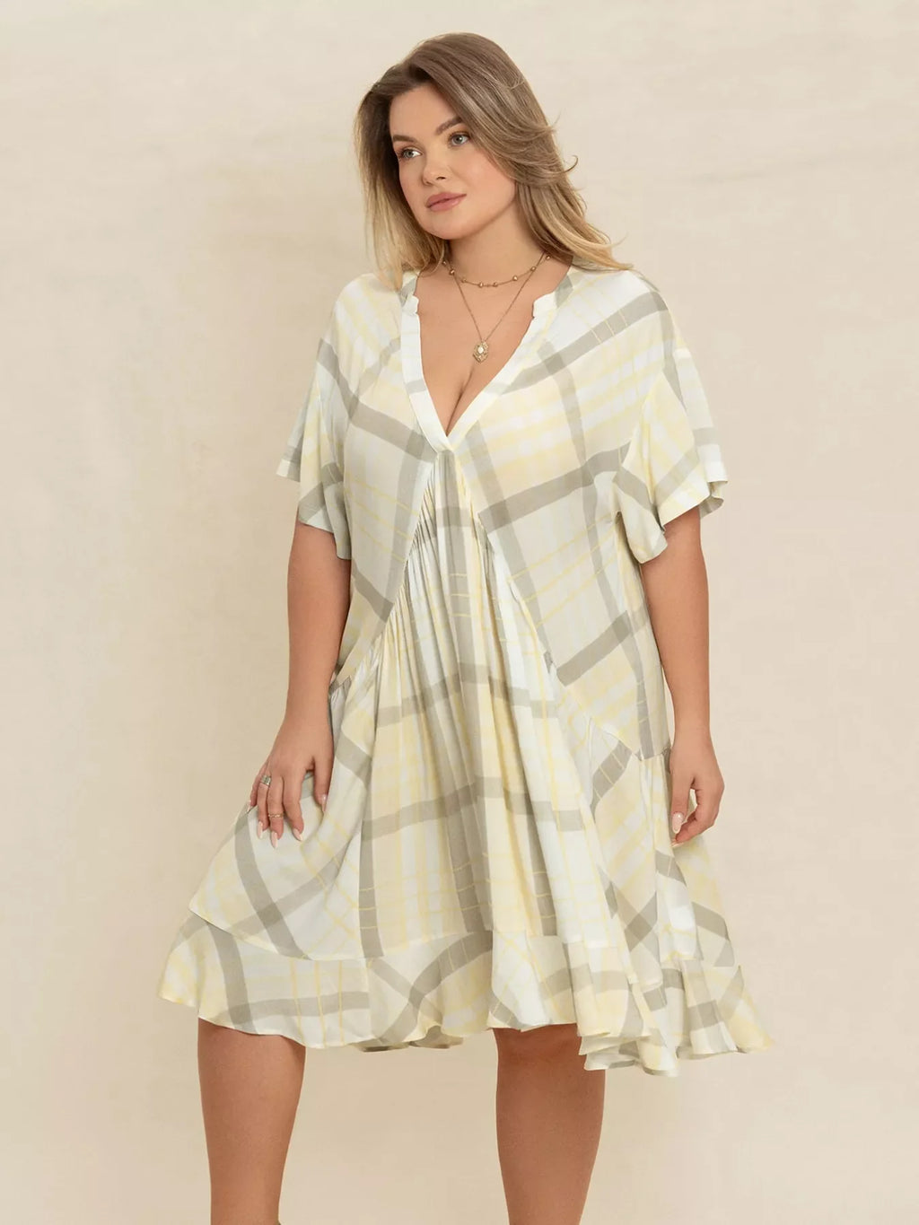 Plus size plaid flutter sleeve dress by Shopimist featuring a flowy design and stylish plaid pattern.