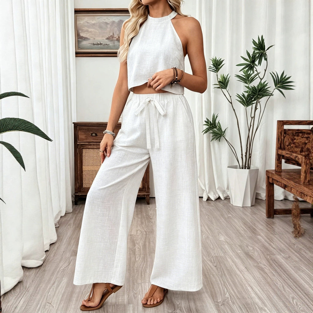 Women's casual two-piece set by FitiqueFit featuring a halter neck cropped top and wide-leg pants, stylish and comfortable ensemble.