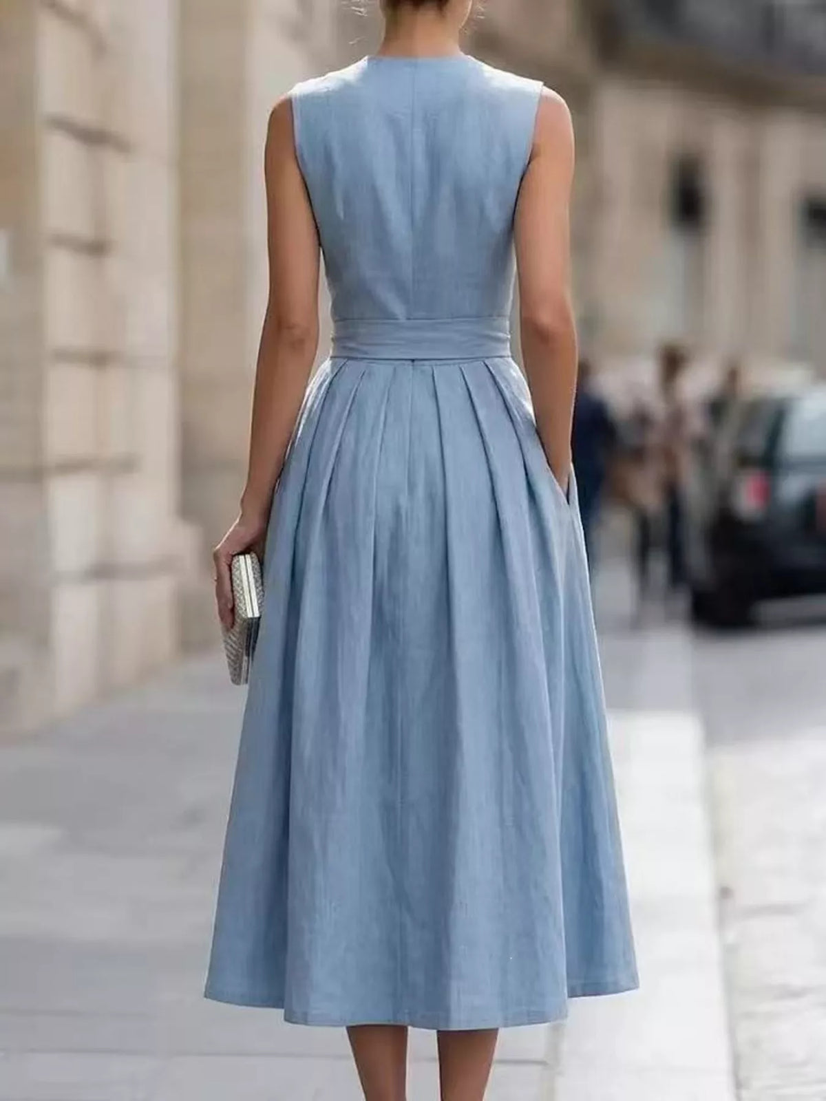 Plus size sleeveless button-front belted midi dress by Trendsi, featuring a flowy fabric and stylish design.