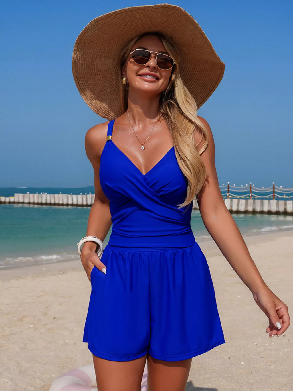 Women's V-neck spaghetti strap one-piece swimsuit by Trendsi, stretchy beachwear swimwear with a sleek V-neck design.