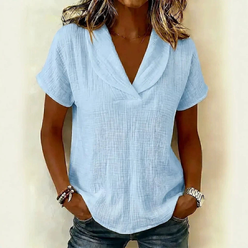 Women's knitted short-sleeve butterfly collar top by Plush Fashion Hub, casualwear with a feminine butterfly collar detail.