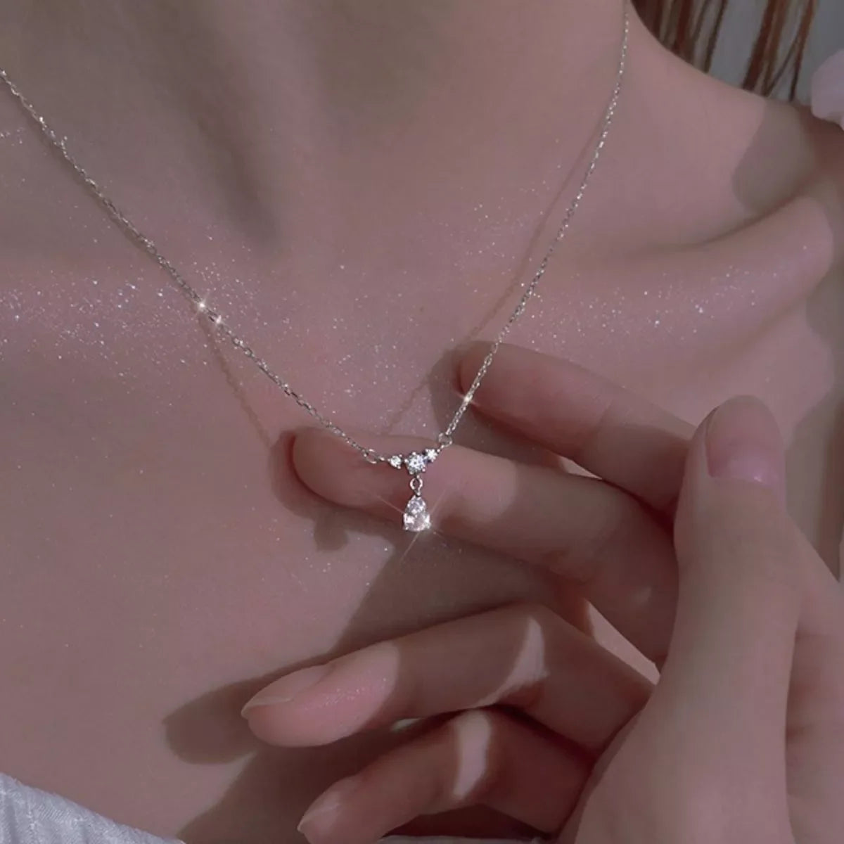 Sterling silver zircon teardrop necklace with delicate chain, showcasing a sparkling teardrop pendant, jewelry piece from Plush Fashion Hub.