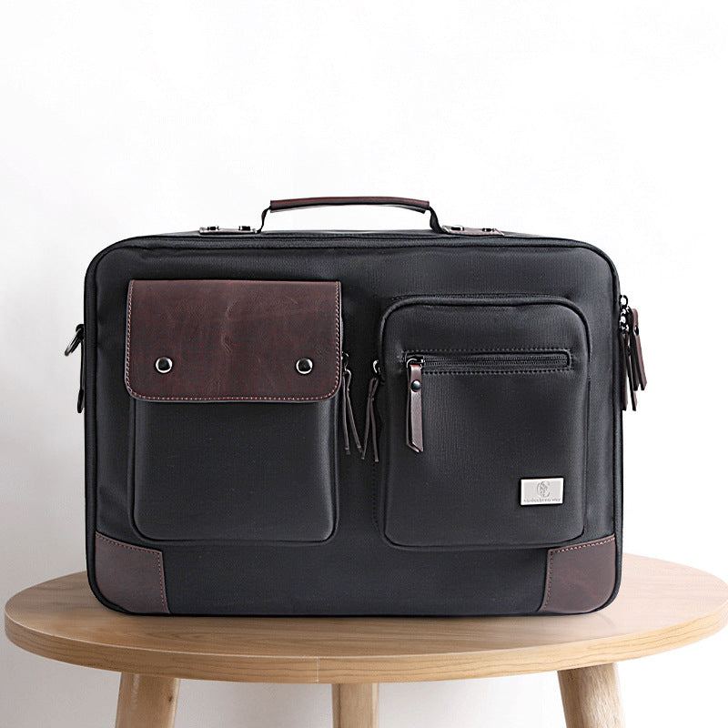 Plush Fashion Hub laptop bag with shoulder strap, portable briefcase style designed for carrying laptops and accessories.