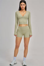 Fitglutes Activewear long sleeve crop top with fitted design, shown in a sleek, stylish look perfect for gym or workout sessions.