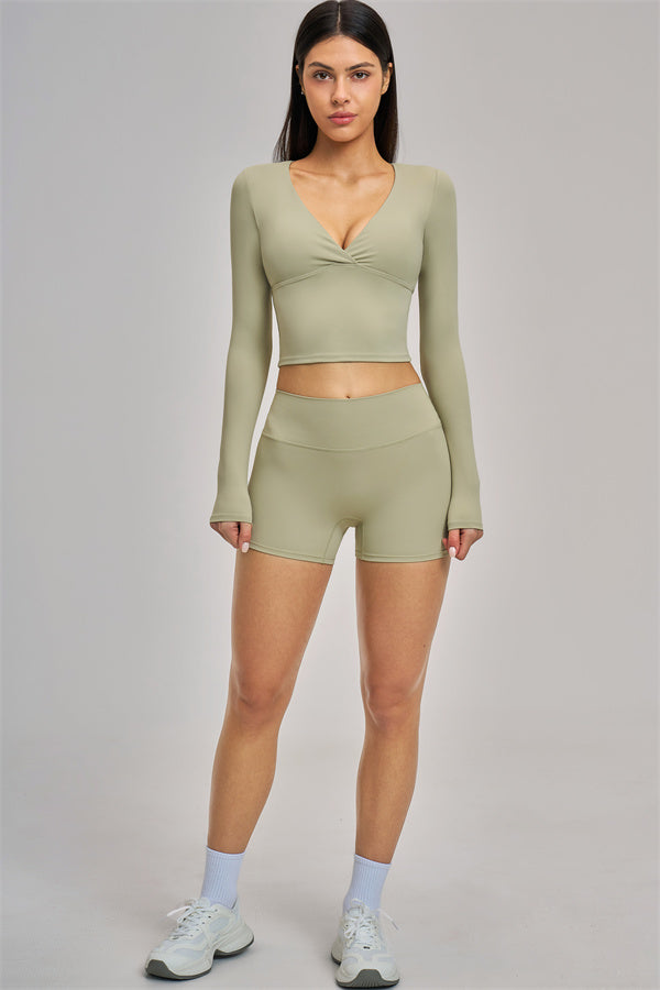 Fitglutes Activewear long sleeve crop top with fitted design, shown in a sleek, stylish look perfect for gym or workout sessions.