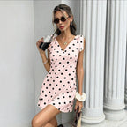 Women's sleeveless V-neck mini dress by FitiqueFit featuring lace-up bow detail and a stylish, fitted silhouette.