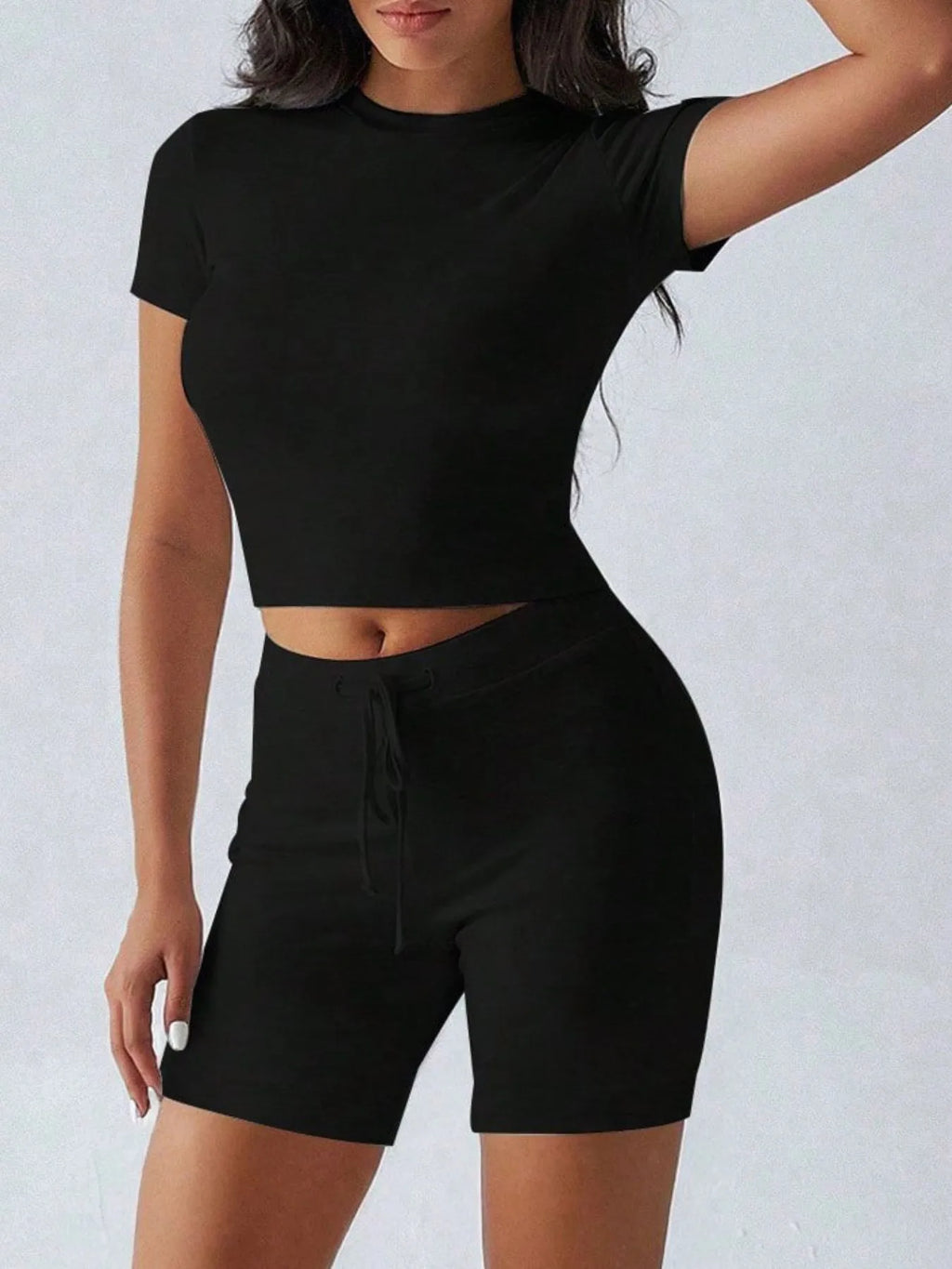 Trendsi active wear set with round neck short sleeve top and matching shorts, made of comfortable fabric for casual wear.