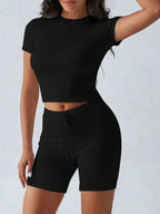 Trendsi active wear set with round neck short sleeve top and matching shorts, made of comfortable fabric for casual wear.