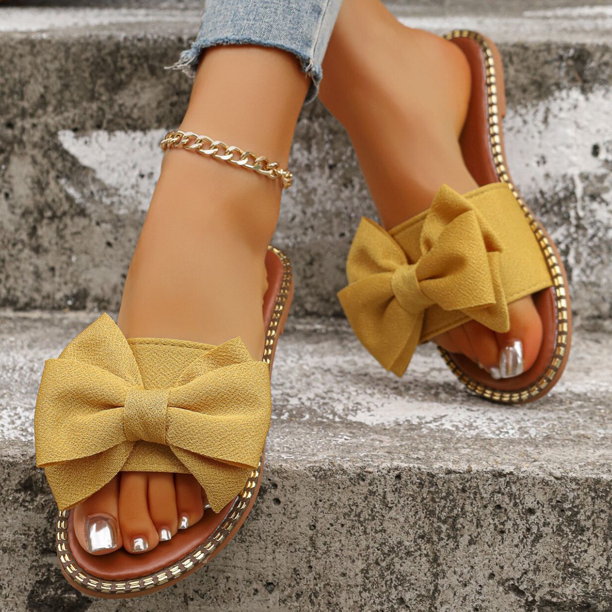 Shopimist Bowknot Embellished Flat Sandals featuring a stylish bow detail and comfortable flat sole, perfect for casual summer wear.