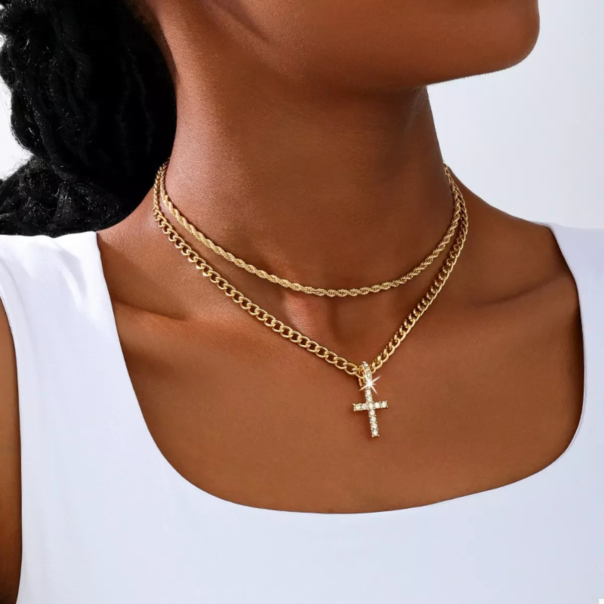 Layered gold chain cross pendant necklace from Plush Fashion Hub, featuring multiple chains and a prominent cross pendant.