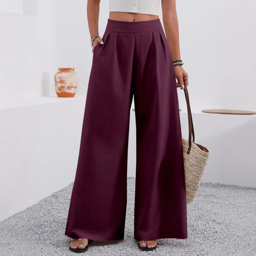 Women's high-waist wide-leg trousers with pockets, full length, in neutral fabric from Plush Fashion Hub, styled for casual or work wear.