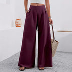 Women's high-waist wide-leg trousers with pockets, full length, in neutral fabric from Plush Fashion Hub, styled for casual or work wear.