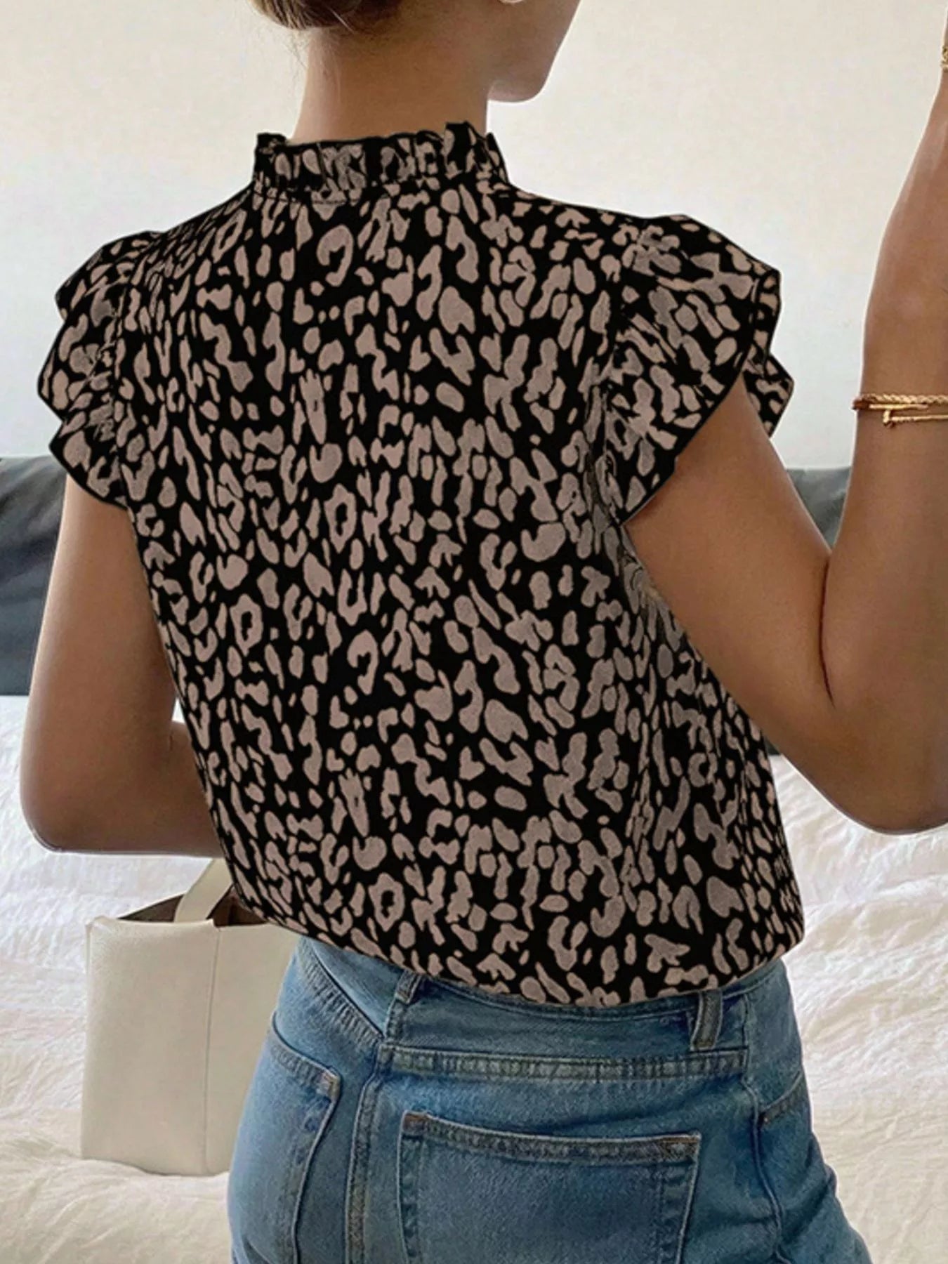 Leopard print ruffle sleeve blouse from Plush Fashion Hub featuring a stylish design and lightweight fabric.