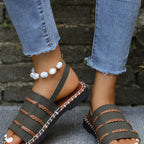 Open toe buckle sandals by Shopimist featuring sleek straps and a stylish buckle detail on a neutral background.