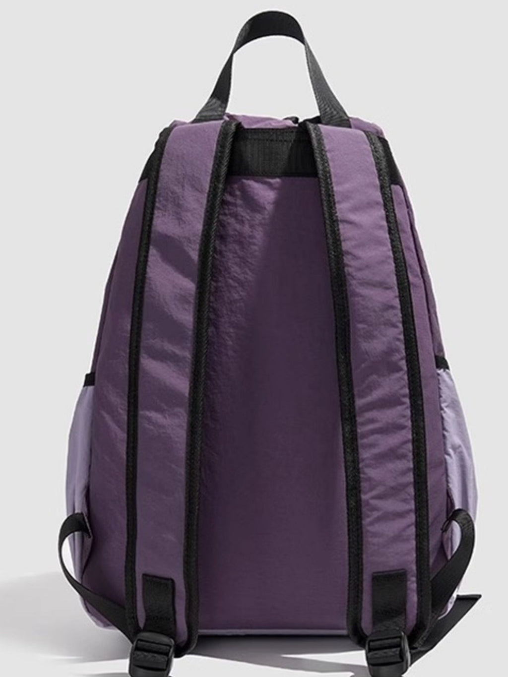 Lightweight nylon drawstring backpack by Trendsi, minimalist travel bag for women with adjustable straps and simple design.