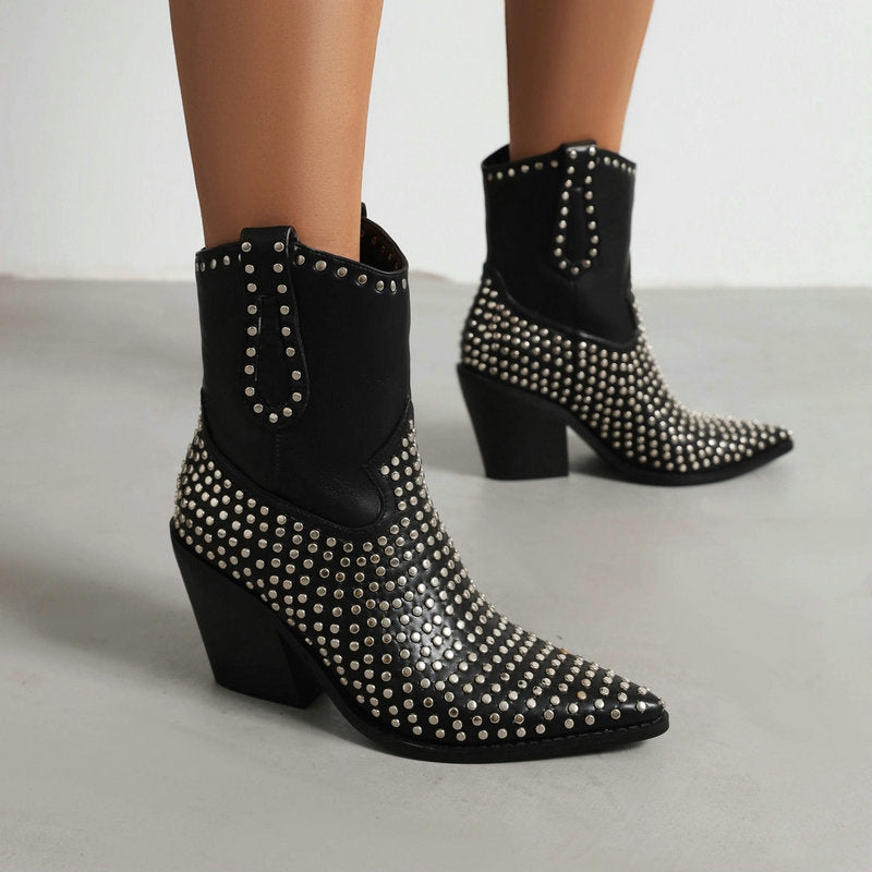 Black faux leather Western style ankle boots with pointed toes, block heels, and silver studs.