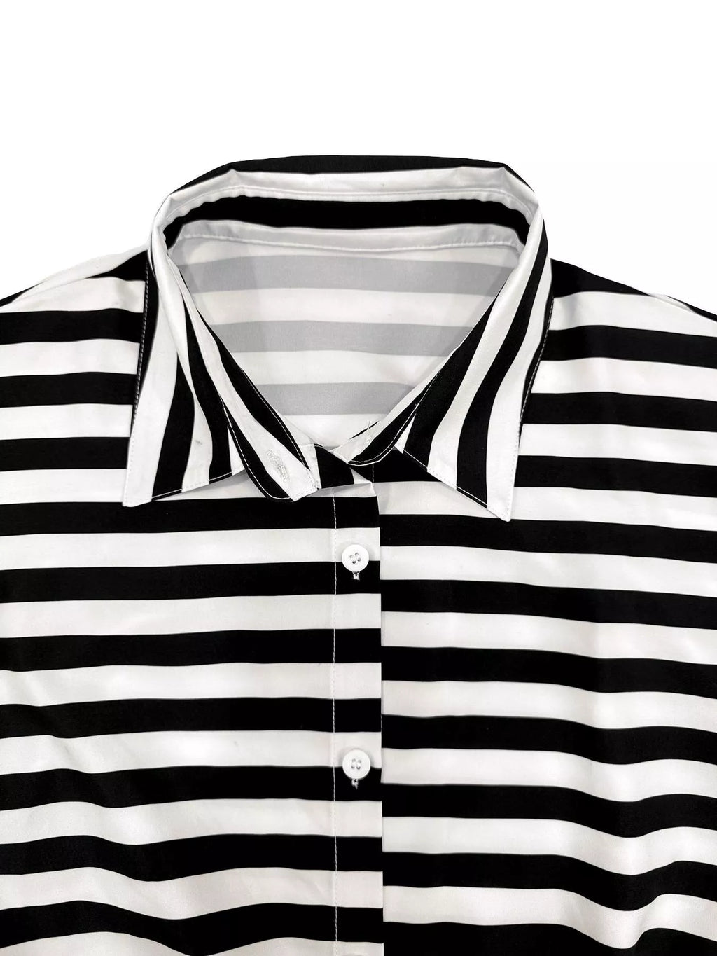 Striped belted jumpsuit from Trendsi featuring a button-up front and relaxed fit, perfect for casual or stylish occasions.
