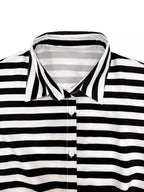 Striped belted jumpsuit from Trendsi featuring a button-up front and relaxed fit, perfect for casual or stylish occasions.