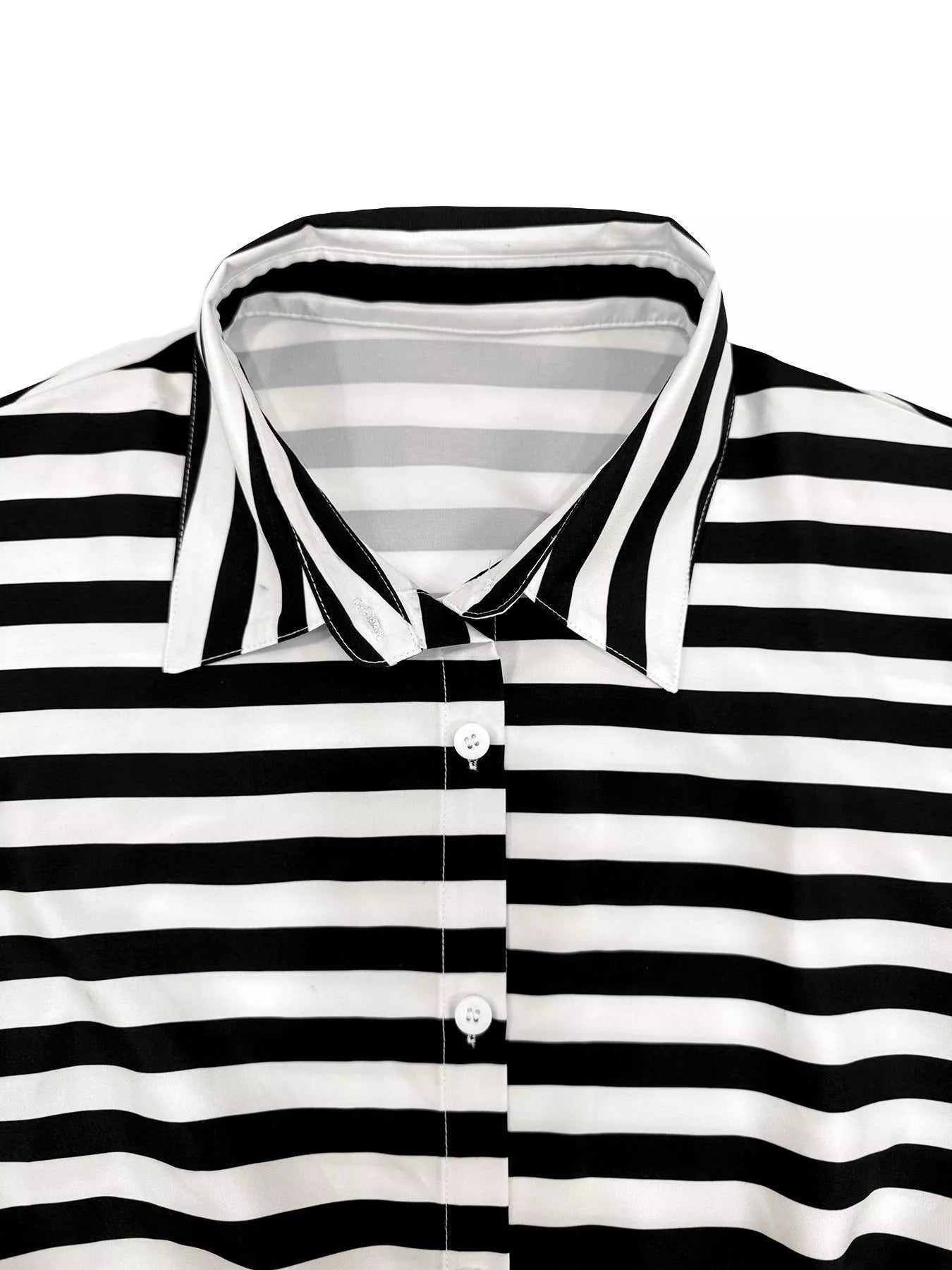 Striped belted jumpsuit from Trendsi featuring a button-up front and relaxed fit, perfect for casual or stylish occasions.