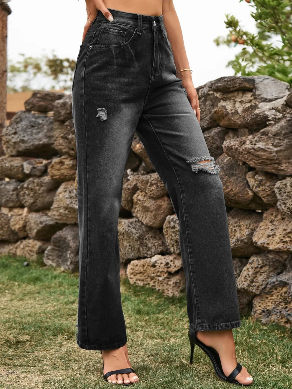 Distressed Plush Fashion Shop denim jeans with front pockets, featuring a casual, worn-in look and rugged style.
