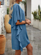 Women's flowy V-neck mini dress with ruffled sleeves, casual style by Trendsi, featuring a relaxed fit and lightweight fabric.
