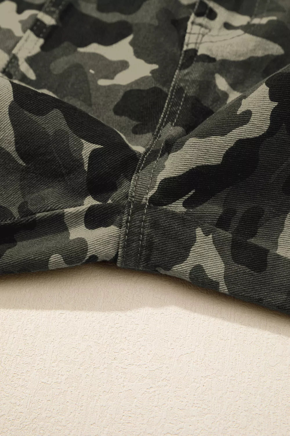 Camouflage print multi-pocketed women's denim pants by Shopimist, featuring a stylish camouflage design and functional pockets.