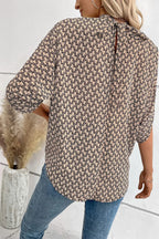 Elegant Plush Fashion Hub tie-back half-sleeve blouse with side slit, stylish tops featuring a flattering fit and sophisticated design.