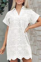Solid color eyelet embroidered T-shirt mini dress from Trendsi, featuring short sleeves and decorative eyelet details.