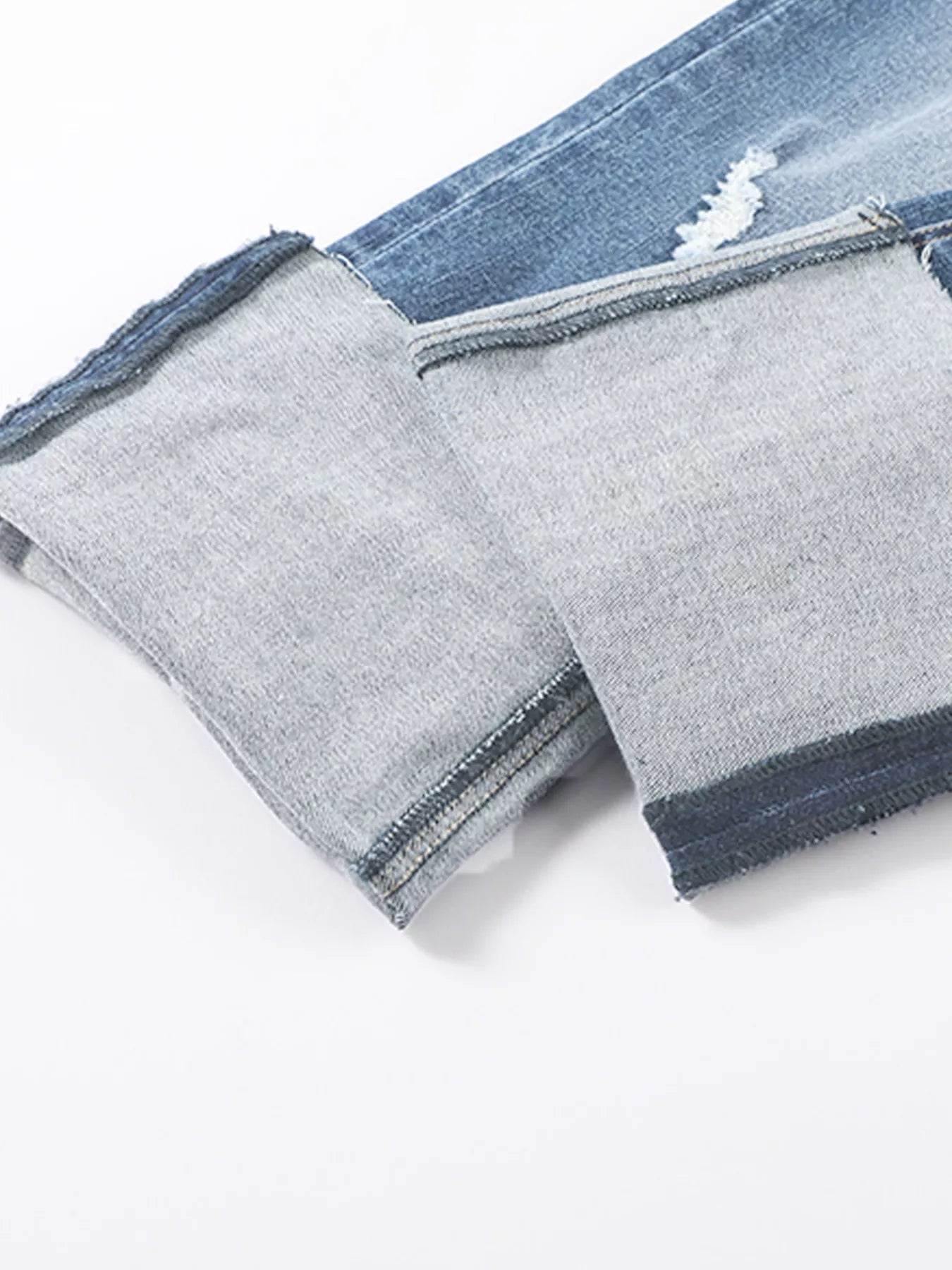 High waist distressed straight leg jeans by Trendsi, showcasing a stylish denim design with ripped details and classic fit.