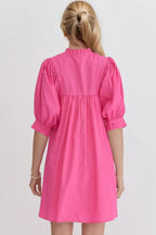 Women's cotton babydoll mini dress with puff sleeves, notched neckline, and pockets, by Trendsi.