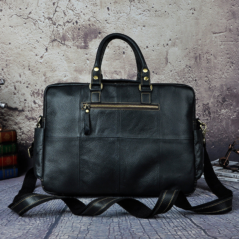 First layer cowhide men's 16-inch large-capacity briefcase from Plush Fashion Hub, with multiple compartments and sturdy leather handle.