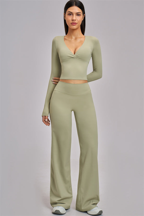 Fitglutes Activewear long sleeve crop top from The Swoon collection, featuring a fitted black gym top with long sleeves and a stylish crop design.