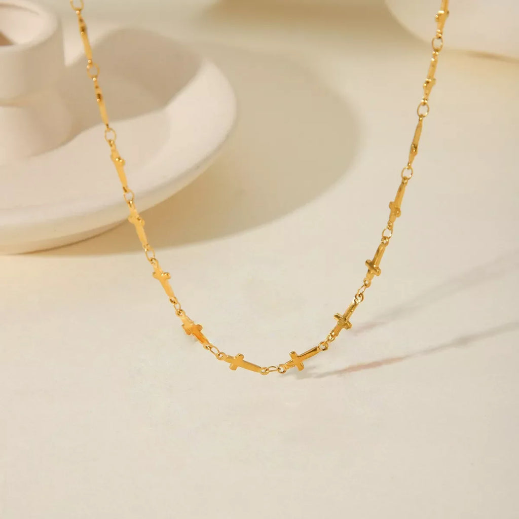 18K gold-plated cross necklace with a delicate chain, stylish jewelry piece from Shopimist featuring a sleek cross pendant.