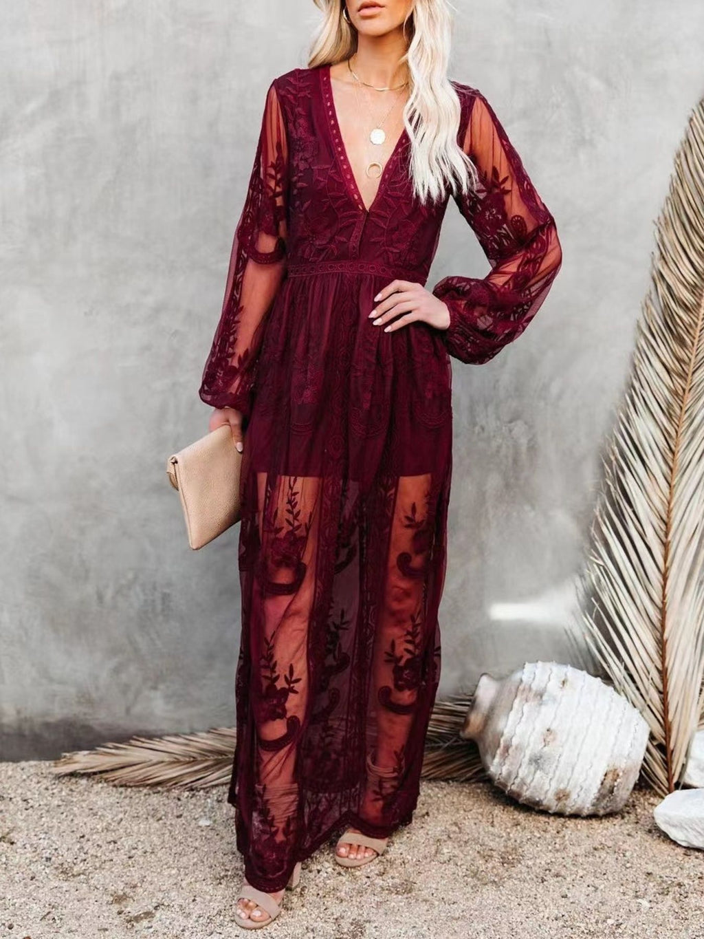 Floral lace high-slit maxi dress by Trendsi featuring elegant design, fitted bodice, and flowing skirt for formal evening occasions.
