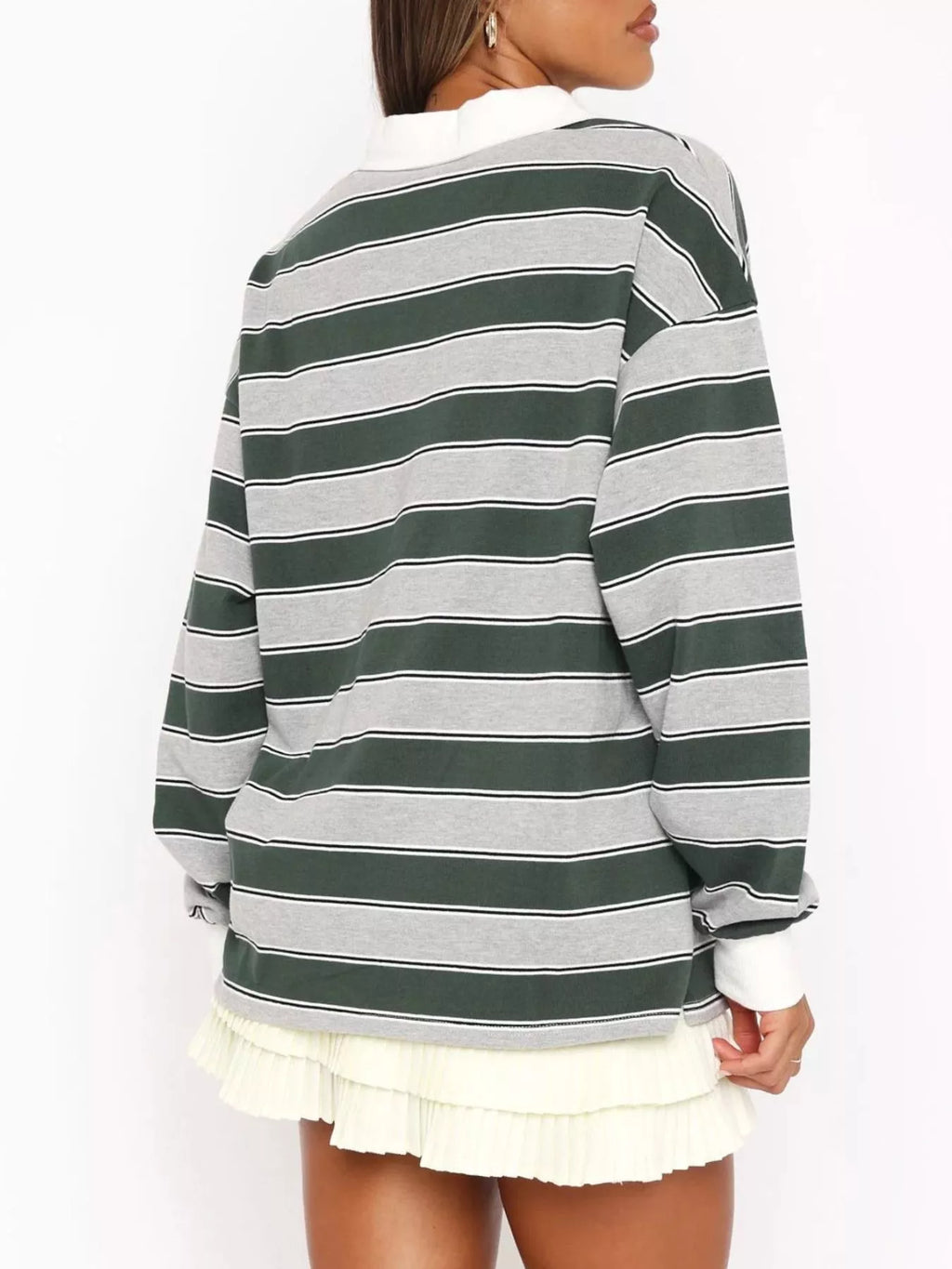 Striped long sleeve polo top with button details from Trendsi, featuring a classic design and ribbed collar.