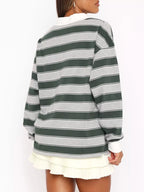 Striped long sleeve polo top with button details from Trendsi, featuring a classic design and ribbed collar.