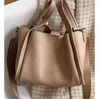Plush Fashion Hub Kira Handbag with sleek design and top handle, featuring a spacious interior and elegant finish.