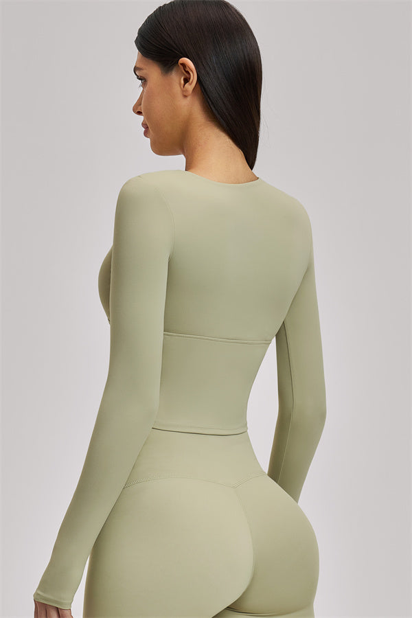 Fitglutes Activewear long sleeve crop top featuring a fitted design, perfect for gym workouts and sports activities.