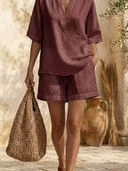 Plus size women's lounge dress with notched half sleeves and pockets, stylish and comfortable by Trendsi.