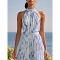 Women's halterneck high-waist swing dress by FitiqueFit featuring floral and solid print casualwear, flowing fabric and stylish design.