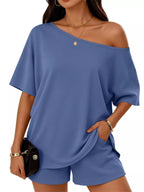 Plus size one-shoulder top and shorts set from Plush Fashion Hub, featuring a stylish, coordinated summer outfit.