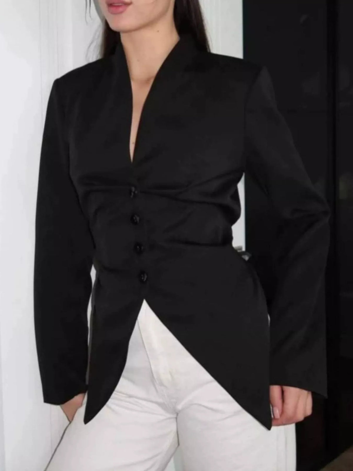 Slim-fit asymmetric hem blazer by Trendsi, featuring tailored design and modern style, shown in a sleek black fabric.