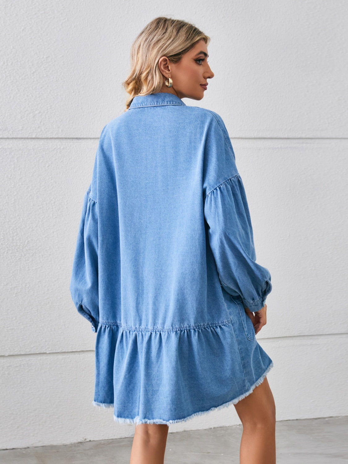 Button-up pocketed raw hem denim dress by Plush Fashion Hub, featuring front pockets and a stylish raw hem design.