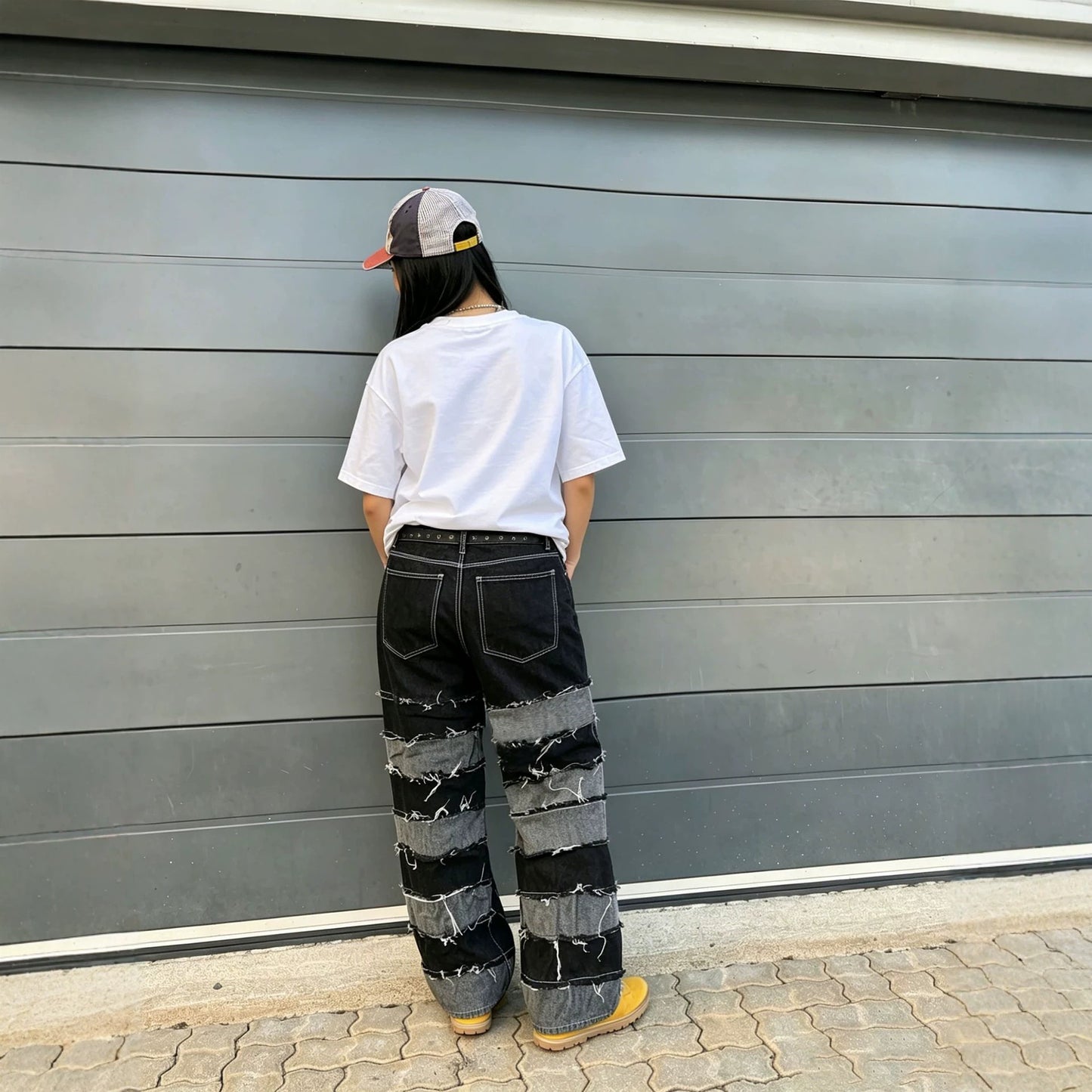 Women’s deconstructed black and gray patchwork straight fit denim jeans by Plush Fashion Hub, showing front view with distressed details.