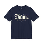 Black T-shirt featuring gothic script "Divine Energy" faith graphic from Wear Your Worship, displayed on a plain background.